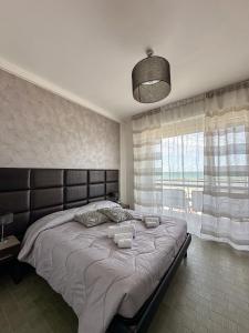 Postel nebo postele na pokoji v ubytování Hotel Re Leone