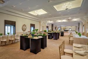 a banquet hall with tables and chairs in a room at Penha Longa Resort in Sintra +37 photos