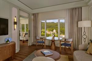 a living room with a couch and a table at Penha Longa Resort in Sintra