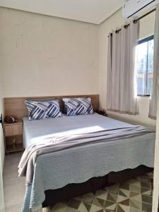 Postel nebo postele na pokoji v ubytování Casa bosque do Garapiá- Taquaruçu