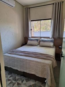 Postel nebo postele na pokoji v ubytování Casa bosque do Garapiá- Taquaruçu