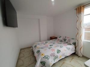 Postel nebo postele na pokoji v ubytování Doña Amalia