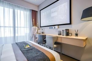 Televizorius ir (arba) pramogų centras apgyvendinimo įstaigoje Raffles Executive Apartment - Guangzhou Huijin International Finance Center, Keyun Road Metro Station Branch-Canton Fair Free Shuttle