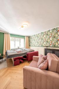 a living room with a bed and a couch at Luxusný apartmán pri nemocnici in Košice