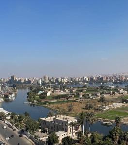 an aerial view of a city with a river at Nile View Apartment - Fully Furnished in Cairo