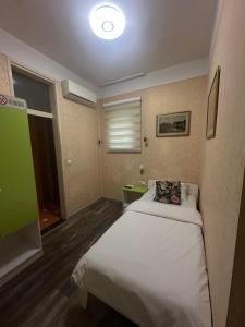 Letto o letti in una camera di Hotel Lula
