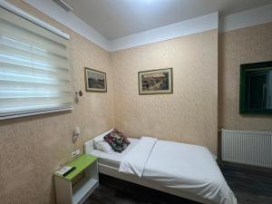 Letto o letti in una camera di Hotel Lula