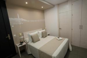 Postel nebo postele na pokoji v ubytování La Pasajera Hostal Boutique