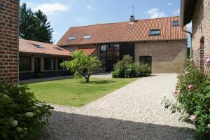 an external view of a house with a garden at La Grange De Salomé in Salomé