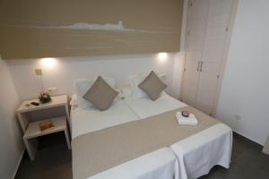 Postel nebo postele na pokoji v ubytování La Pasajera Hostal Boutique