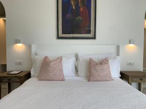 A bed or beds in a room at Bettola del Re home boutique b&b