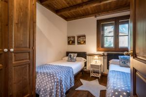 A bed or beds in a room at Colomers by Totiaran