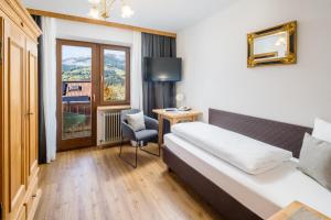 Posteľ alebo postele v izbe v ubytovaní Hotel Standlhof Zillertal