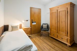 Posteľ alebo postele v izbe v ubytovaní Hotel Standlhof Zillertal