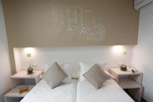 Postel nebo postele na pokoji v ubytování La Pasajera Hostal Boutique