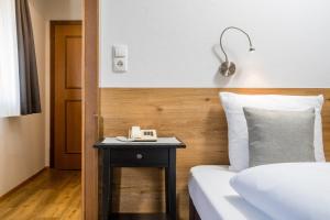 Posteľ alebo postele v izbe v ubytovaní Hotel Standlhof Zillertal