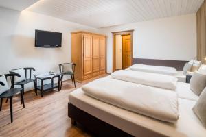Posteľ alebo postele v izbe v ubytovaní Hotel Standlhof Zillertal
