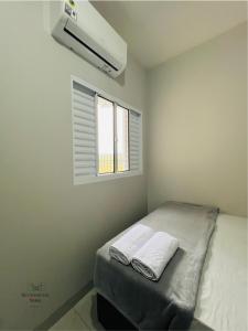 Postel nebo postele na pokoji v ubytování Residencial Yama