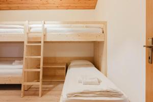 A bed or beds in a room at La Mansarda di nonna Delfa