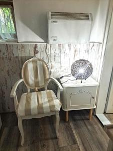 a room with a chair and a table with a mirror at Villa Magicland in Sofia +159 photos