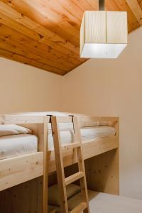 A bed or beds in a room at La Mansarda di nonna Delfa