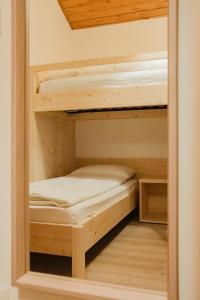 A bed or beds in a room at La Mansarda di nonna Delfa