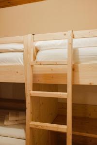 A bed or beds in a room at La Mansarda di nonna Delfa