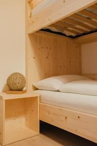 A bed or beds in a room at La Mansarda di nonna Delfa