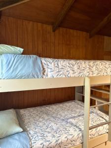 Postel nebo postele na pokoji v ubytování Cabañas Mahatua