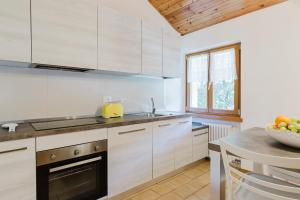 A kitchen or kitchenette at La Mansarda di nonna Delfa