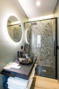 MH SUITES Plebiscito的一间浴室