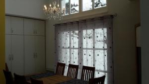 a dining room with a table and a window at Ferienhaus in Sankt Margarethen Lungau mit Garten in Sankt Margarethen im Lungau