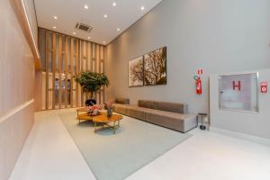 Apartamentos Studio Allure Moema - Com café da manhã opcional, Recepção e Valet 24 horas的休息区