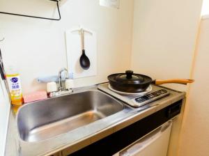Kuchyň nebo kuchyňský kout v ubytování F HOUSE Os Residence S1