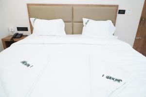 Postel nebo postele na pokoji v ubytování Hotel Jai's Inn