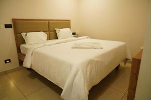 Postel nebo postele na pokoji v ubytování Hotel Jai's Inn