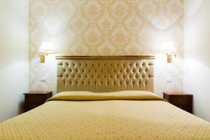 Ένα ή περισσότερα κρεβάτια σε δωμάτιο στο Hotel Bramante