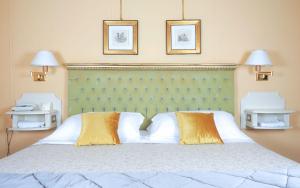 Ένα ή περισσότερα κρεβάτια σε δωμάτιο στο Hotel Bramante