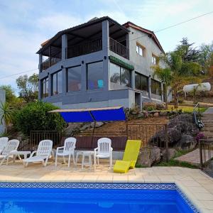 Swimmingpoolen hos eller tæt på Complejo Refugio Playa Perelli