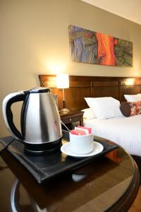 Cama ou camas em um quarto em Hotel Mendoza