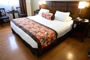 Cama ou camas em um quarto em Hotel Mendoza