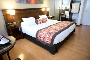 Cama ou camas em um quarto em Hotel Mendoza