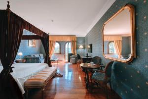 Ένα ή περισσότερα κρεβάτια σε δωμάτιο στο Hotel Bramante