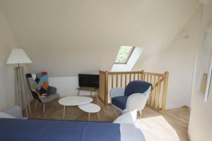 TV a/nebo společenská místnost v ubytování La Maison des Vergers