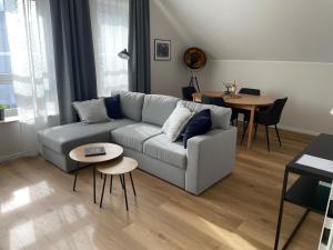 a living room with a couch and a table at Moderne Wohnung - renoviert 2024 in Solingen