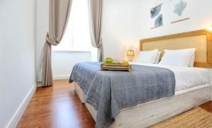 Katil atau katil-katil dalam bilik di Maison Faro Luxe - A Tranquil Retreat by the Algarve Coast