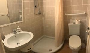 a bathroom with a sink and a toilet at La Casa Rossa in Marina di Bibbona +27 photos