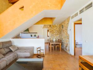 a living room with a couch and a table at Cubo's La Casa Azul in Villafranco de Guadalhorce