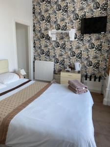 Postel nebo postele na pokoji v ubytování Belhaven Private Hotel