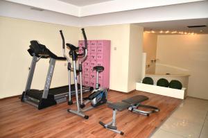 a gym with exercise equipment in a room at Hotel Tilmen in Gaziantep